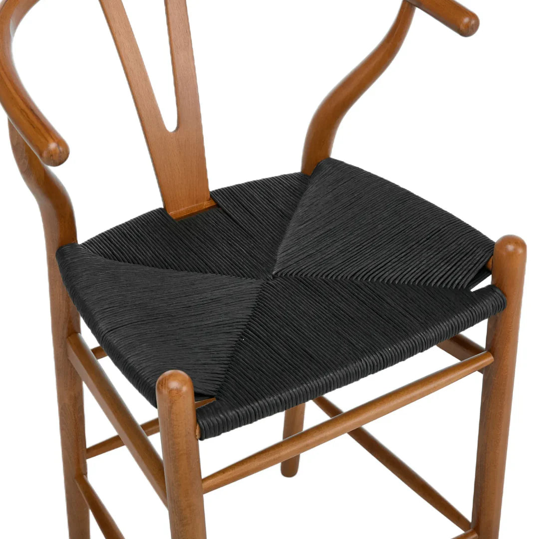 Wooden chair with black woven seat on a white background
