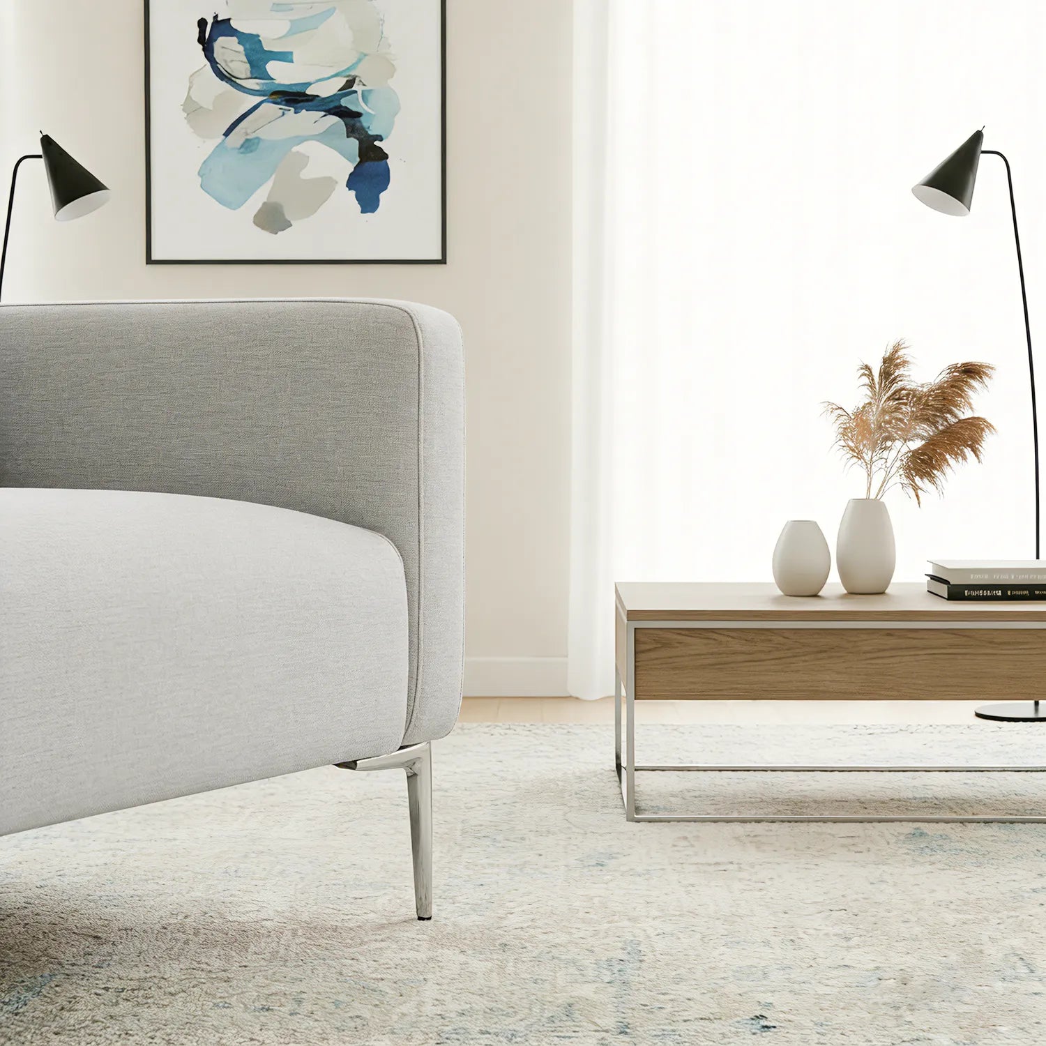 Modern living room with a gray sofa, wooden coffee table, and abstract art on the wall.