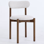 Chair with wooden frame and white cushion on a light gray background