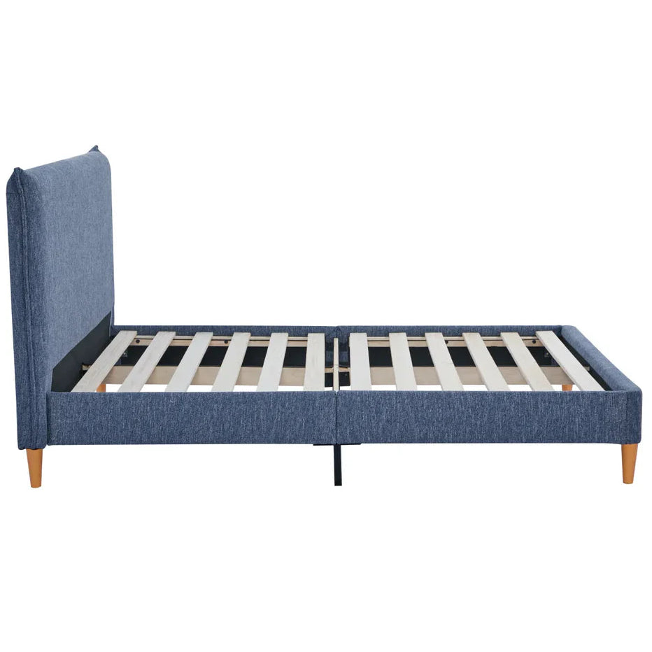 Blue upholstered bed frame with wooden legs on a white background