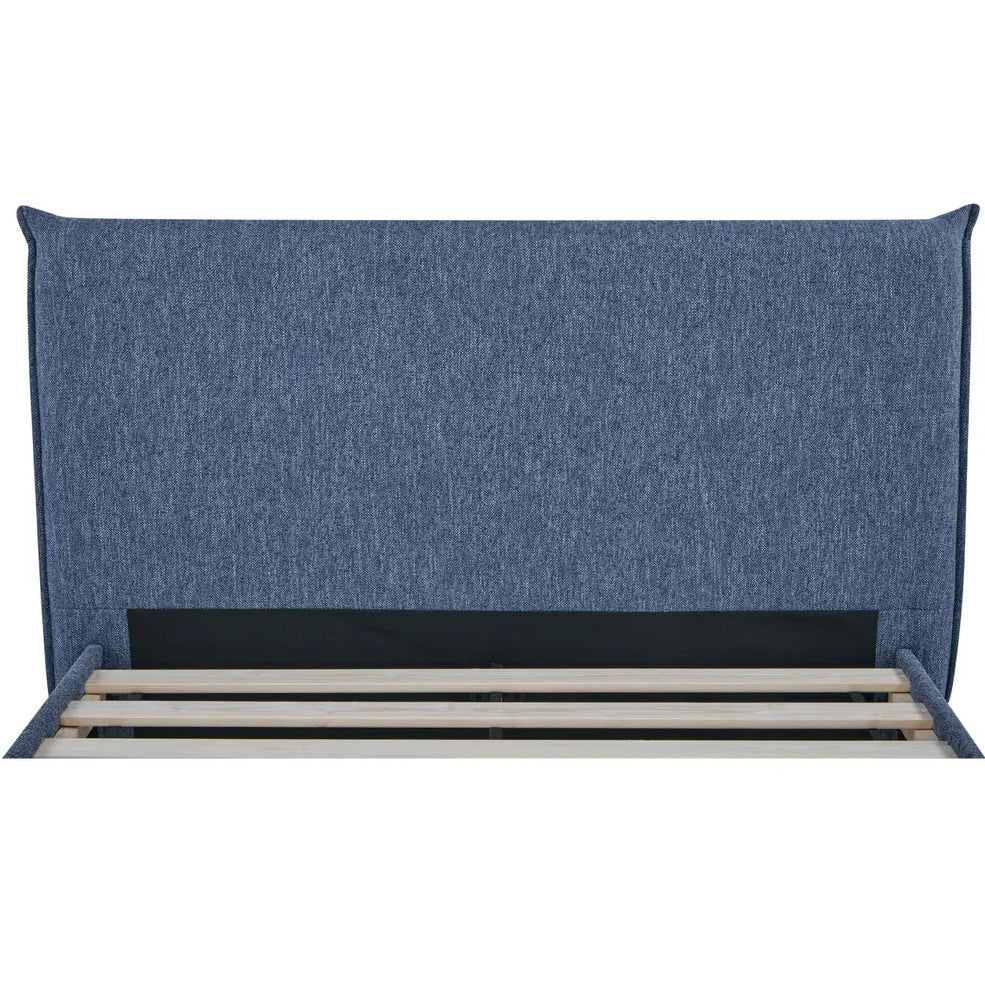 Blue upholstered headboard on a white background
