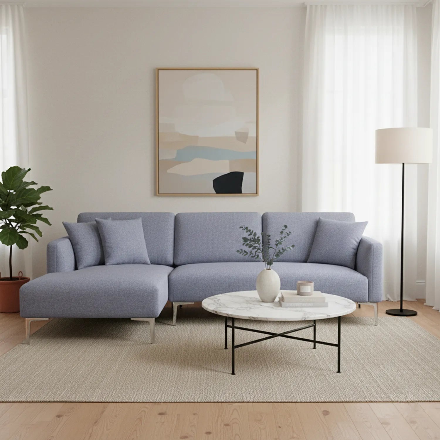 Modern living room with a gray sectional sofa, marble coffee table, and abstract art on the wall.