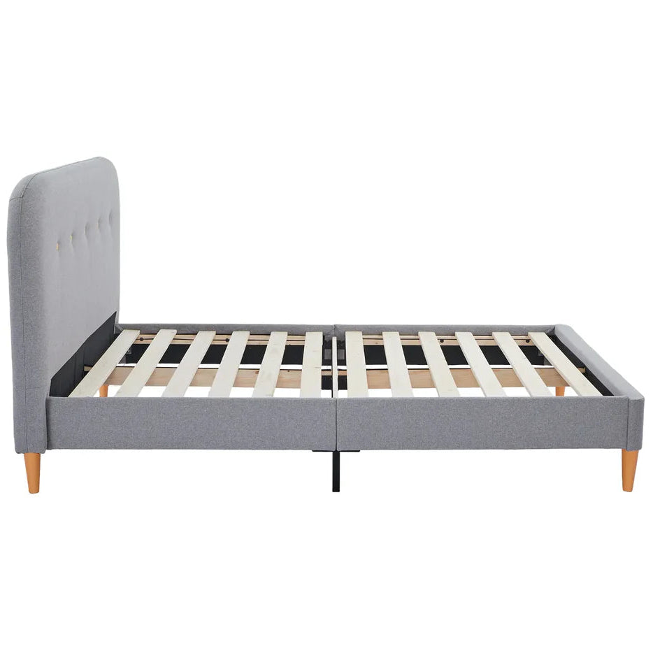 Gray upholstered bed frame with wooden legs on a white background